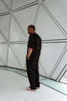 MANA SPC track pants in black, side